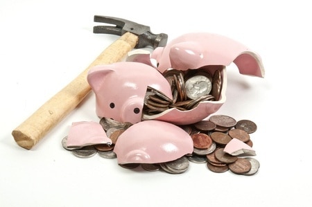 broken piggy bank hammer money