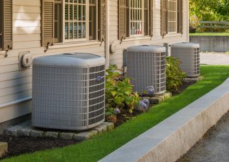 HVAC Heating,And,Air,Conditioning,Inverters,On,The,Side,Of,A