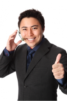 Smiling man on headset thumbs up shutterstock_175304513