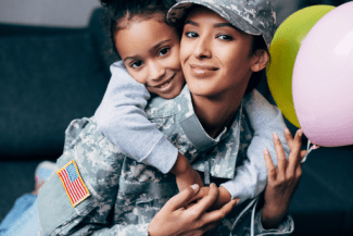 Lady soldier and child Shutterstock_754745797