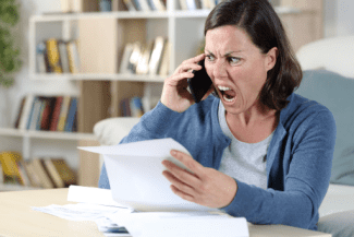 Angry lady on phone Shutterstock_1760704781