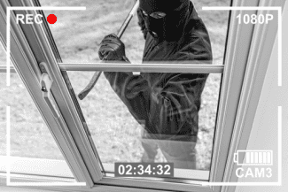 Burglar breaking in Shutterstock_1201091188
