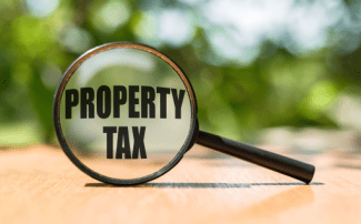 Property tax magnifying glass Shutterstock_1890921502
