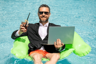 Businessman in pool shutterstock_2292477669 (1)