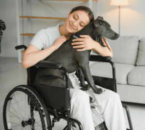 Woman in Wheelchair + Dog Shutterstock_2178166695