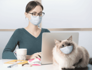 Covid lady and cat with masks Shutterstock_1684893613