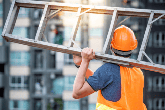 Maintenance man carrying ladder Shutterstock_1160676829
