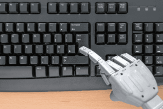 Robot hand on typewriter Shutterstock_198393527