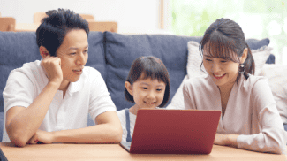 Family time on computer Shutterstock_1977055124