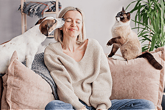 Woman with pets Shutterstock_2159704675